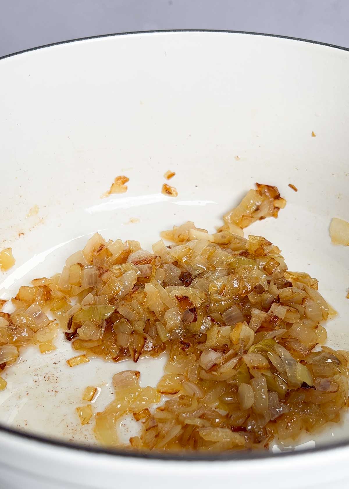 golden brown, caramelised onions in a pot
