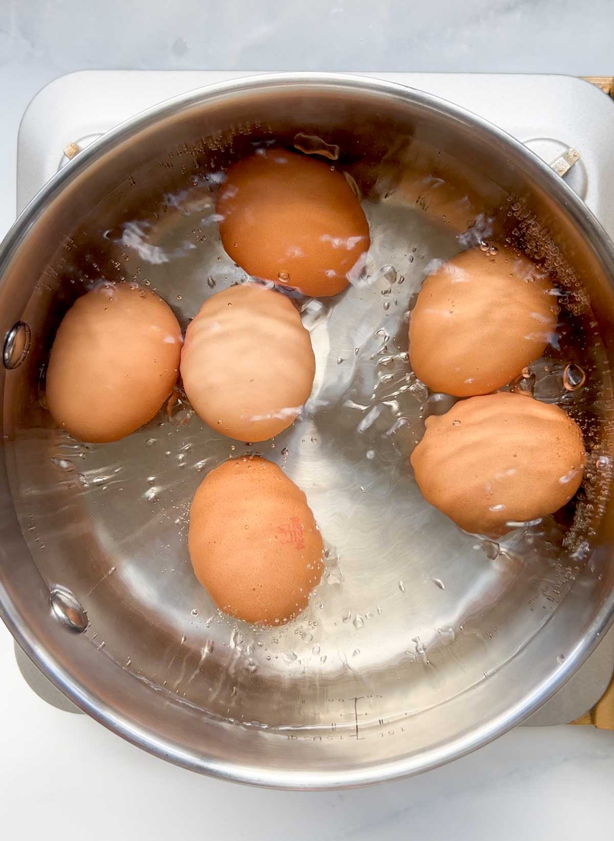 pot of boiled eggs in water