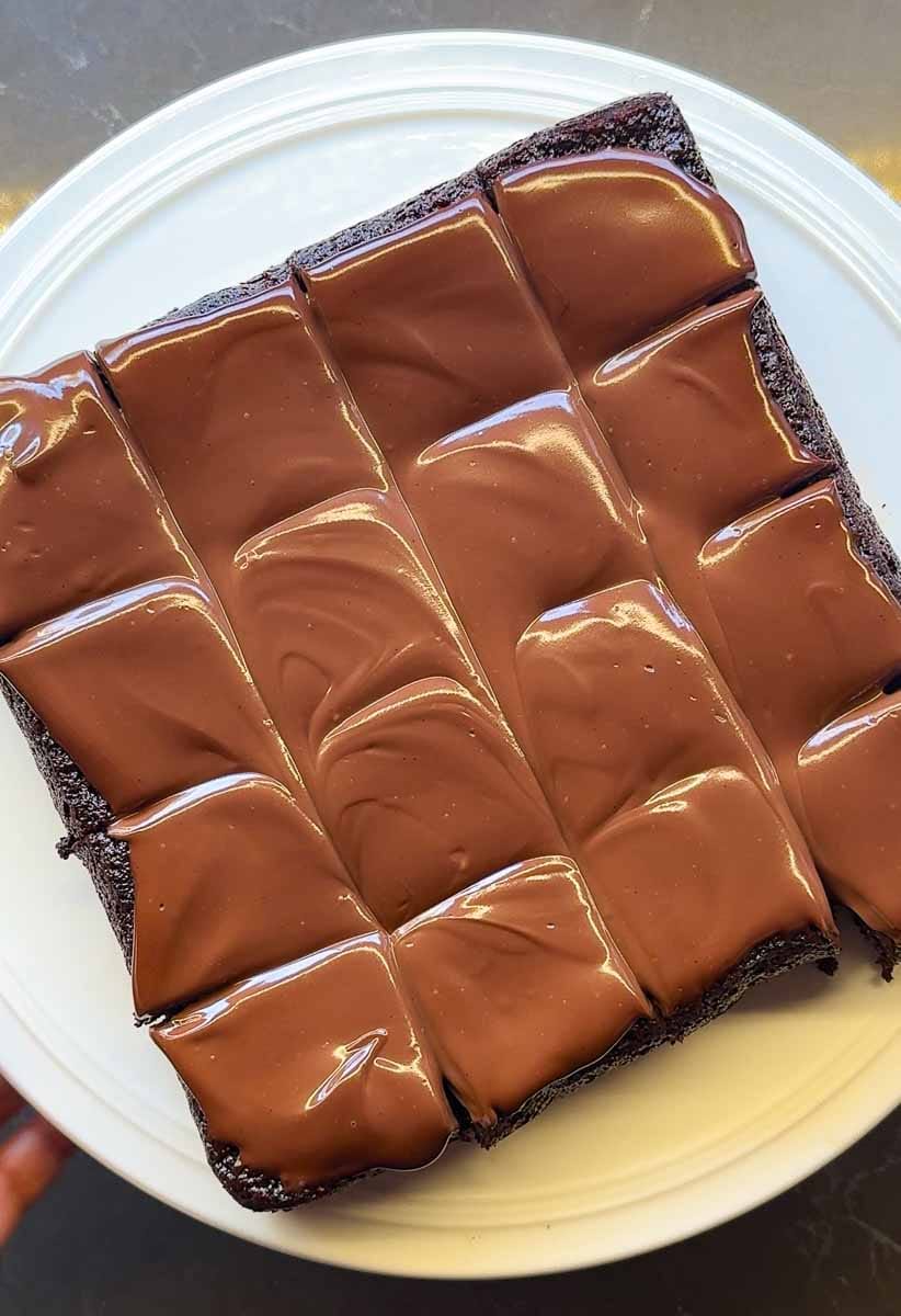 square slab of entire best healthy frosted almond flour brownies cut into 16 pieces